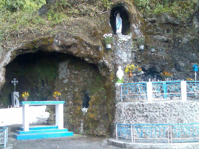 Grotto shrine with a statue of Mary inside a cave near St. Mary's Hill, Kurseong